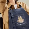 SERIE LOS MONSTRUOS CAEN EN SALVAJE – Bolsa de mezclilla con delantal