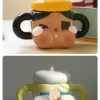 Taza de cerámica CRYBABY Sad Club Series (dorada)
